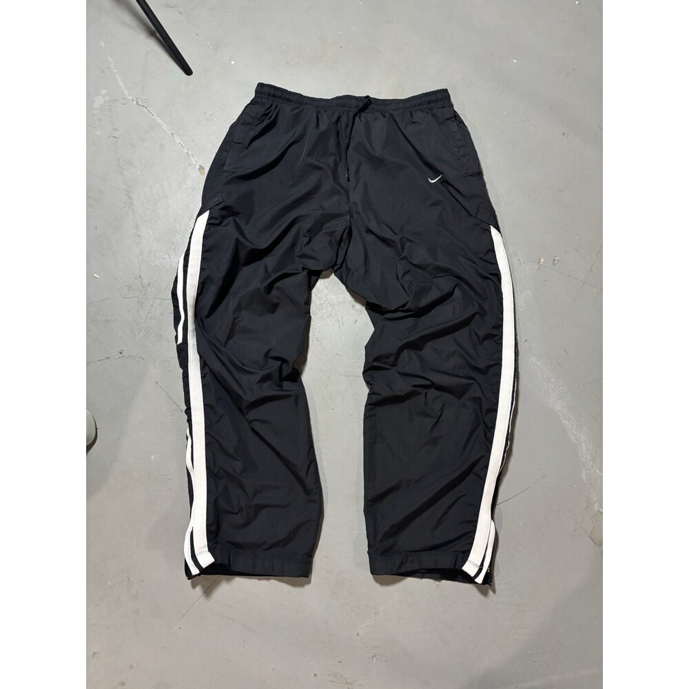 Nike Y2K nylon track pants Size Large W white side stripes W a small swoosh logo